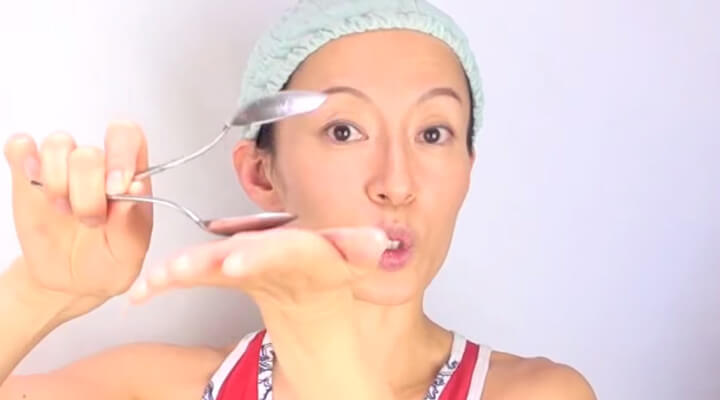 Fumiko Takatsu showing how to get rid of frown lines with two spoons