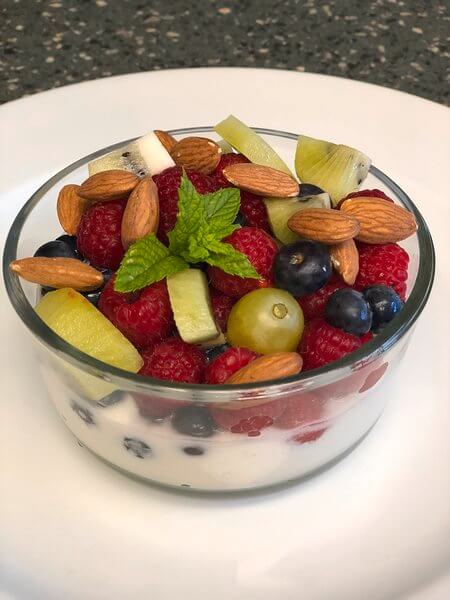 Fruit salad with nuts and greek yogurt